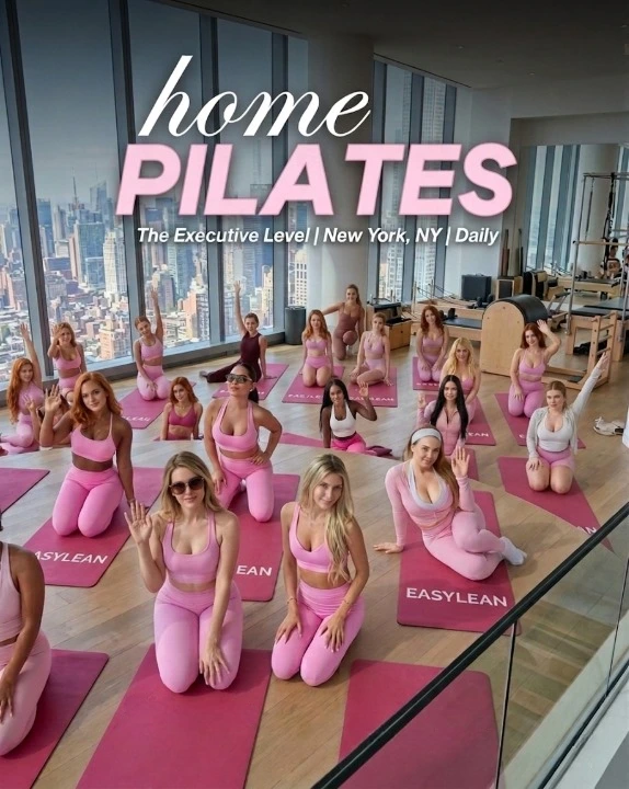 A large group of women practicing home pilates on pink EasyLean yoga mats in a New York studio, showcasing the EasyLean fitness lifestyle.