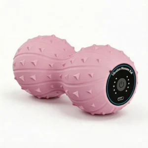 Pink electric vibrating peanut massage ball with textured surface for deep tissue trigger point therapy and muscle recovery.