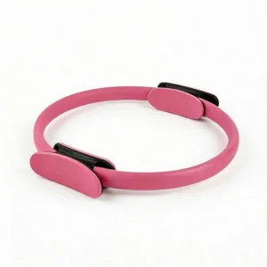 A pink Pilates ring magic circle with dual-sided padded handles for inner thigh and core strength training.