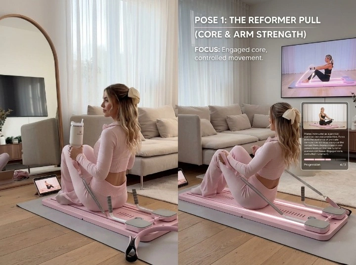 Young woman in pink activewear following a Pilates video tutorial on a tablet while using the easylean foldable reformer at home.