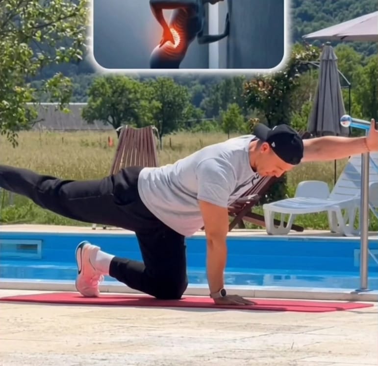 The Sedentary Desk Worker’s Survival Guide: 9 Home Rehab Exercises to Eliminate Lower Back Pain, Anterior Pelvic Tilt, and "Tech Neck" 6 A man performing the bird dog exercise on a yoga mat to strengthen deep core and relieve lower back pain from sitting