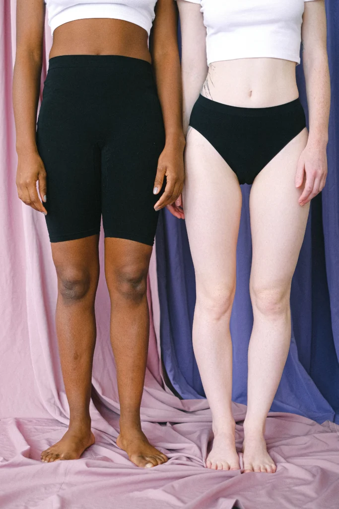 🏋️♀️ Why Does Everyone Secretly (or Openly) Hate Leg Day? 1 Two women with different skin tones showcasing slim and toned lower body lines to prove you do not have to hate leg day to get results.